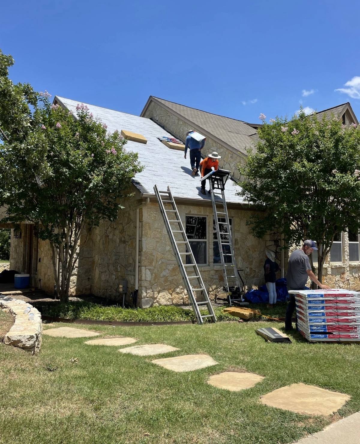 Salter crew installing CertainTeed shingles over synthetic underlayment