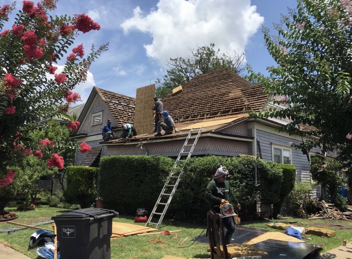 Salter crew tearing off an old roof and replacing roof decking
